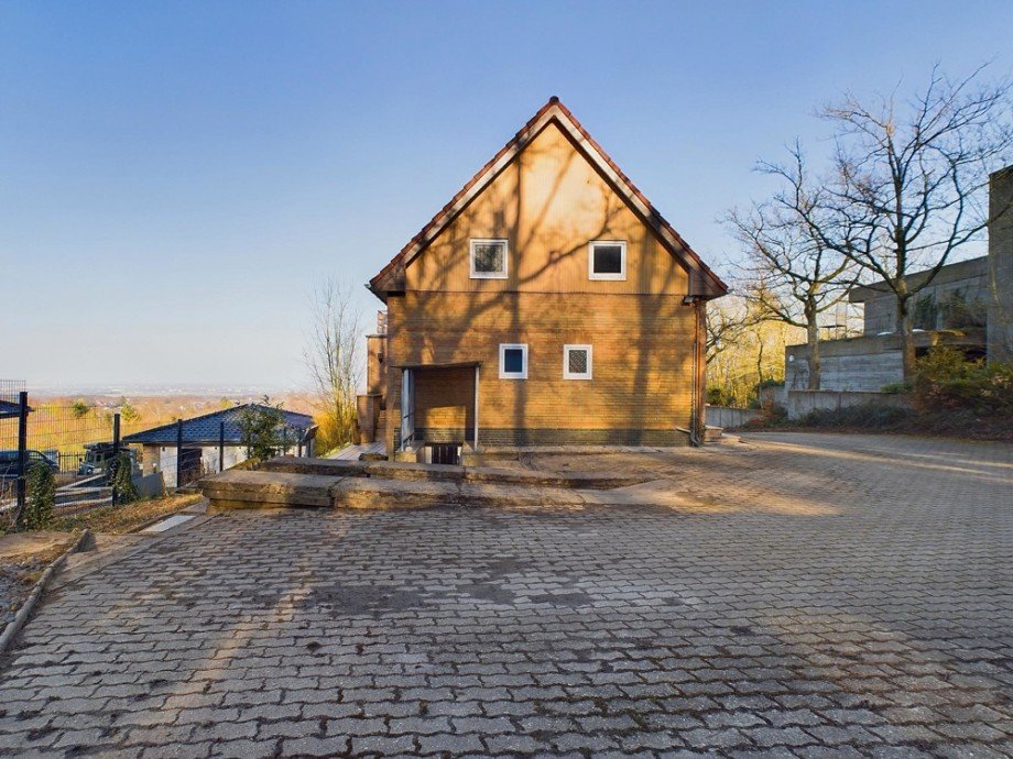 R�ckansicht Einfamilienhaus H�rtgenwald / Gey