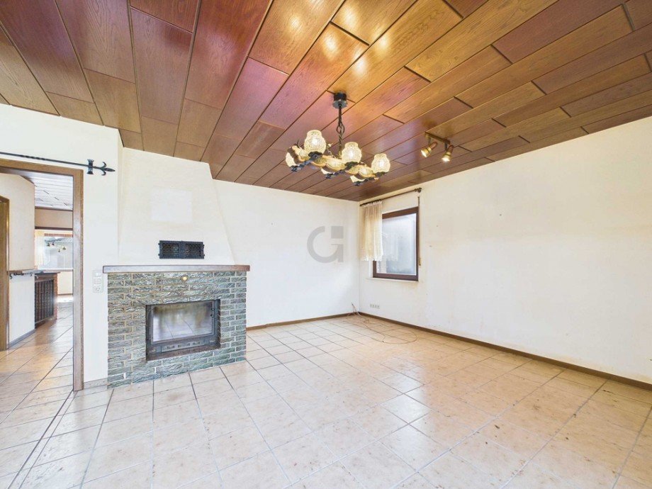 Wohnbereich mit Kaminofen Bungalow D�ren / Echtz